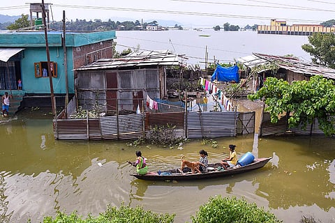 People shift their belongings on a boat